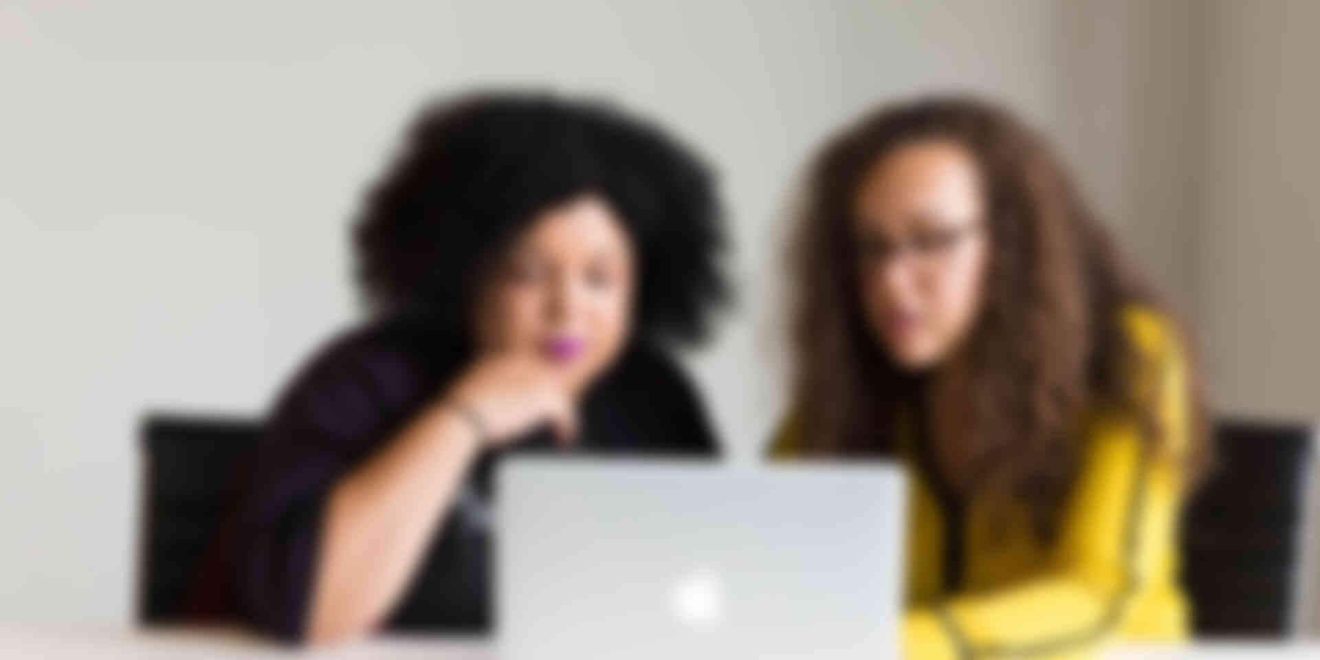 Blog - two-women-talking-over-computer