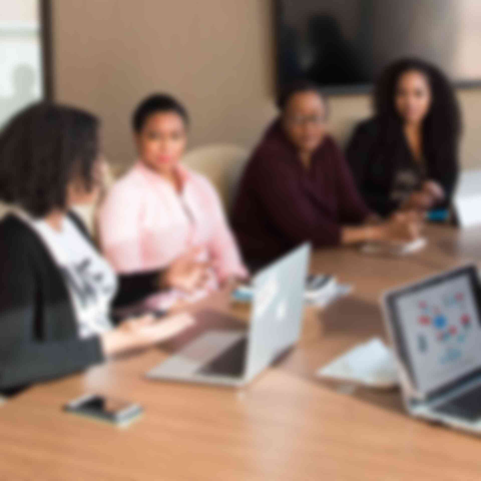 Making Meetings Work - four-women-talking-at-meeting