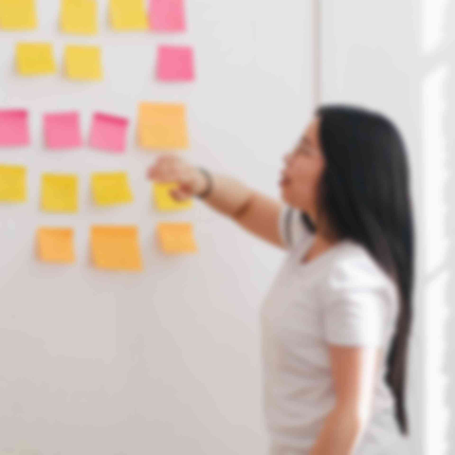 Technical Presenting to Groups - woman-presenting-with-sticky-notes